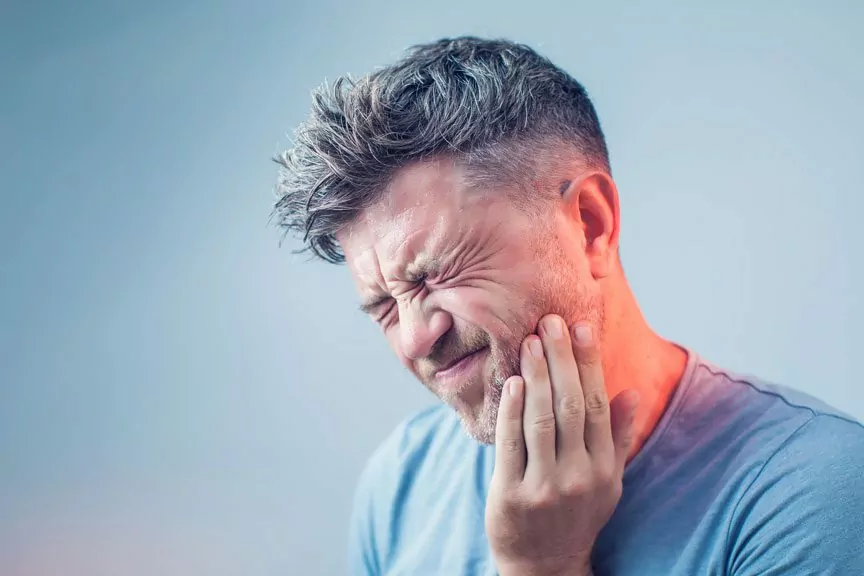 Man Experiencing Jaw Pain In Oakville, ON.