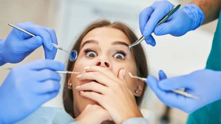 A Woman Being Examined By Dentist