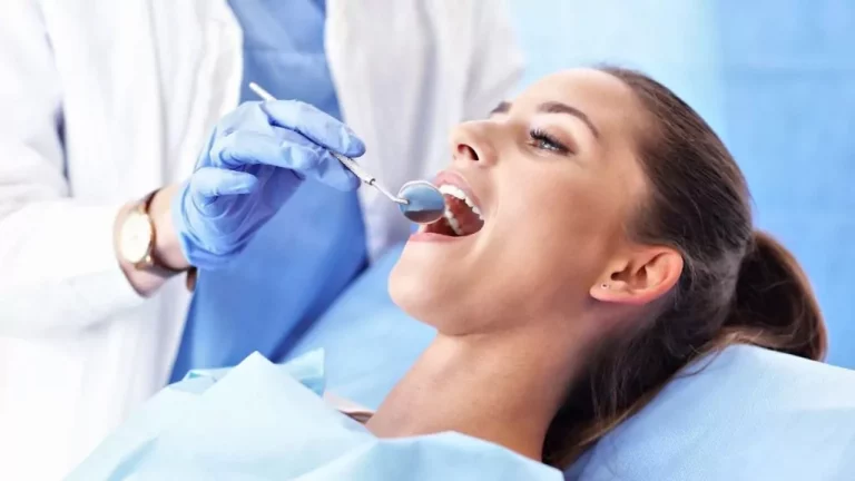 Woman Getting Her Teeth Checked By The Dentist