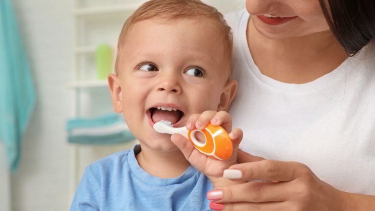 A Baby Brushing His Teeth