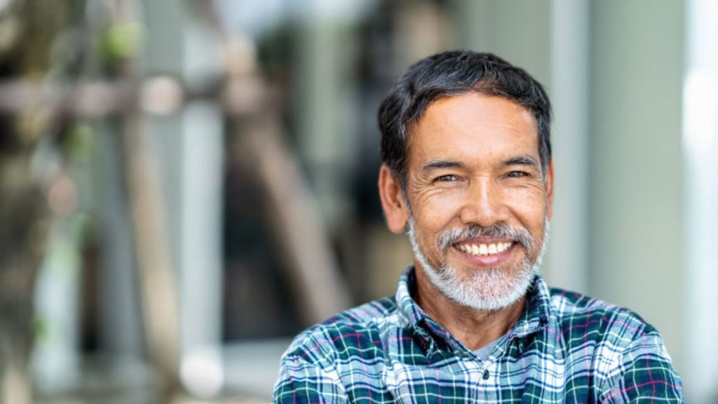A Smiling Man With A Beard