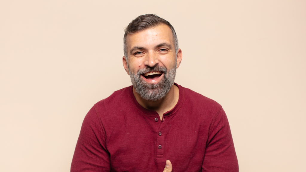 Man Smiling After Getting Dental Crown