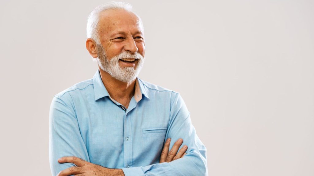 Senior Man Smiling After Tooth Replacement