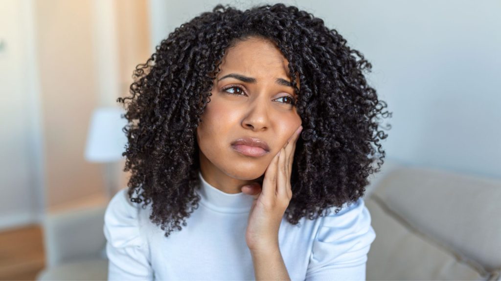 Woman In Pain From Impacted Wisdom Teeth
